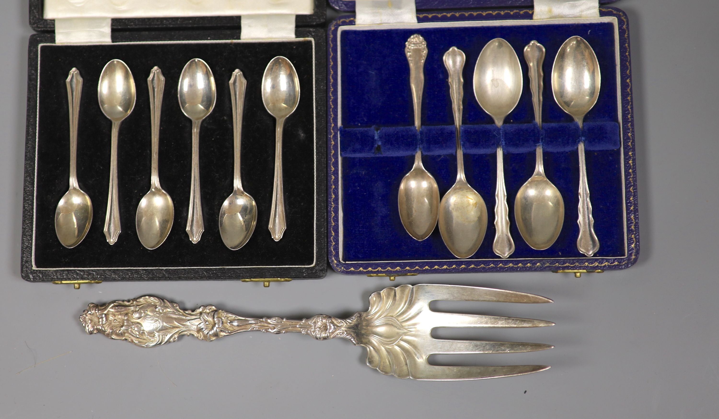 A collection of small silver including condiments, mirror and brushes, astray, cased items and a pair of sterling servers.